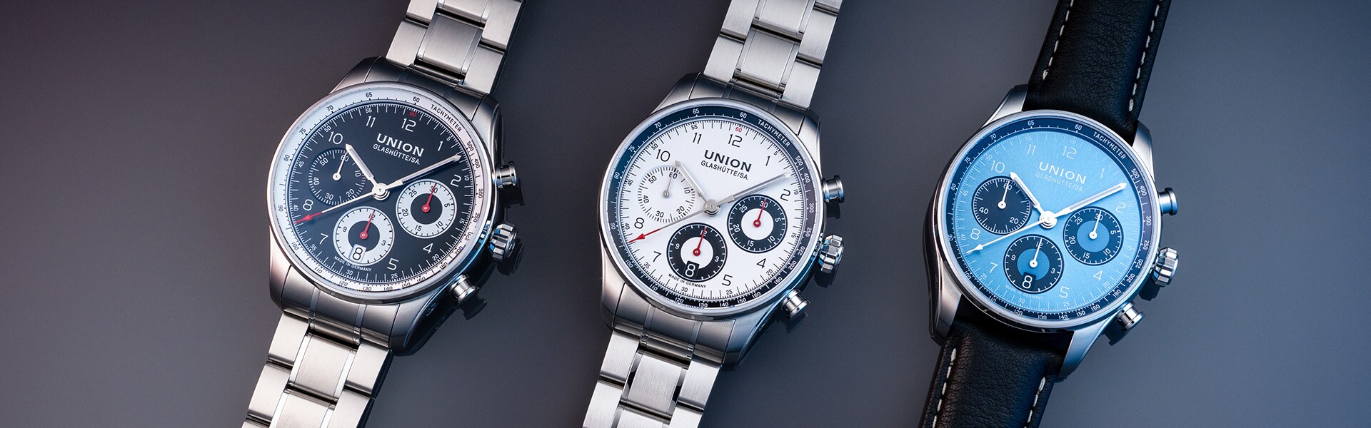 Three watches from the same series with dials in black, white and blue.